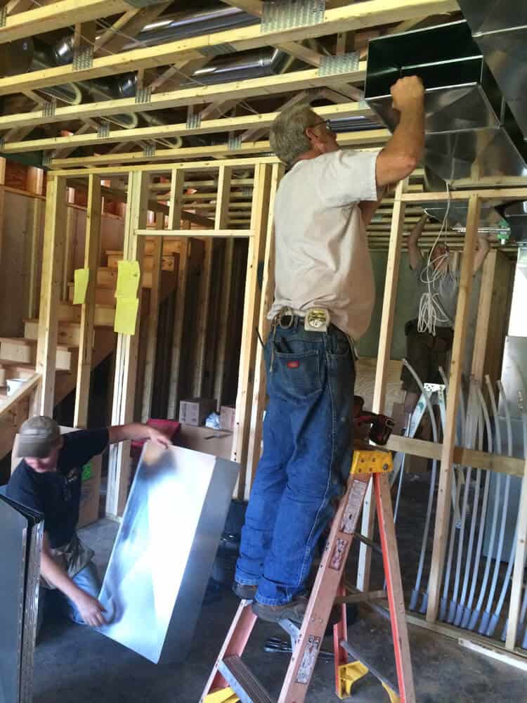 Hanging ductwork in a new construction home.