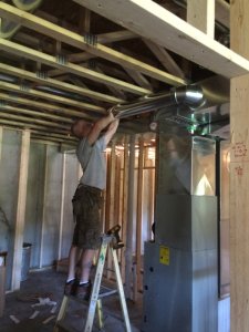 Hanging ductwork in a new construction home.
